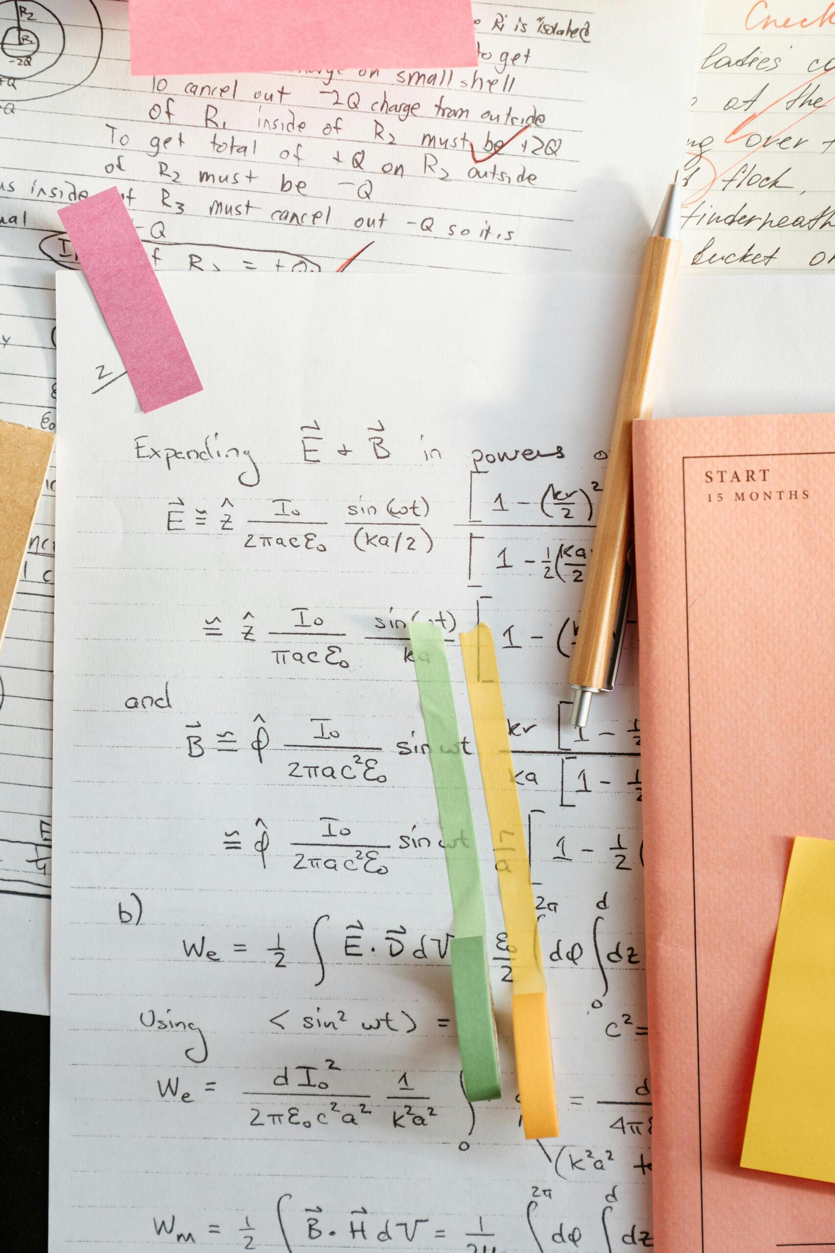 Handwritten math solutions on a white sheet of paper.