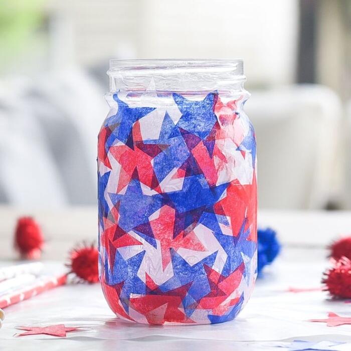mason jar with paper stars in red, white and blue